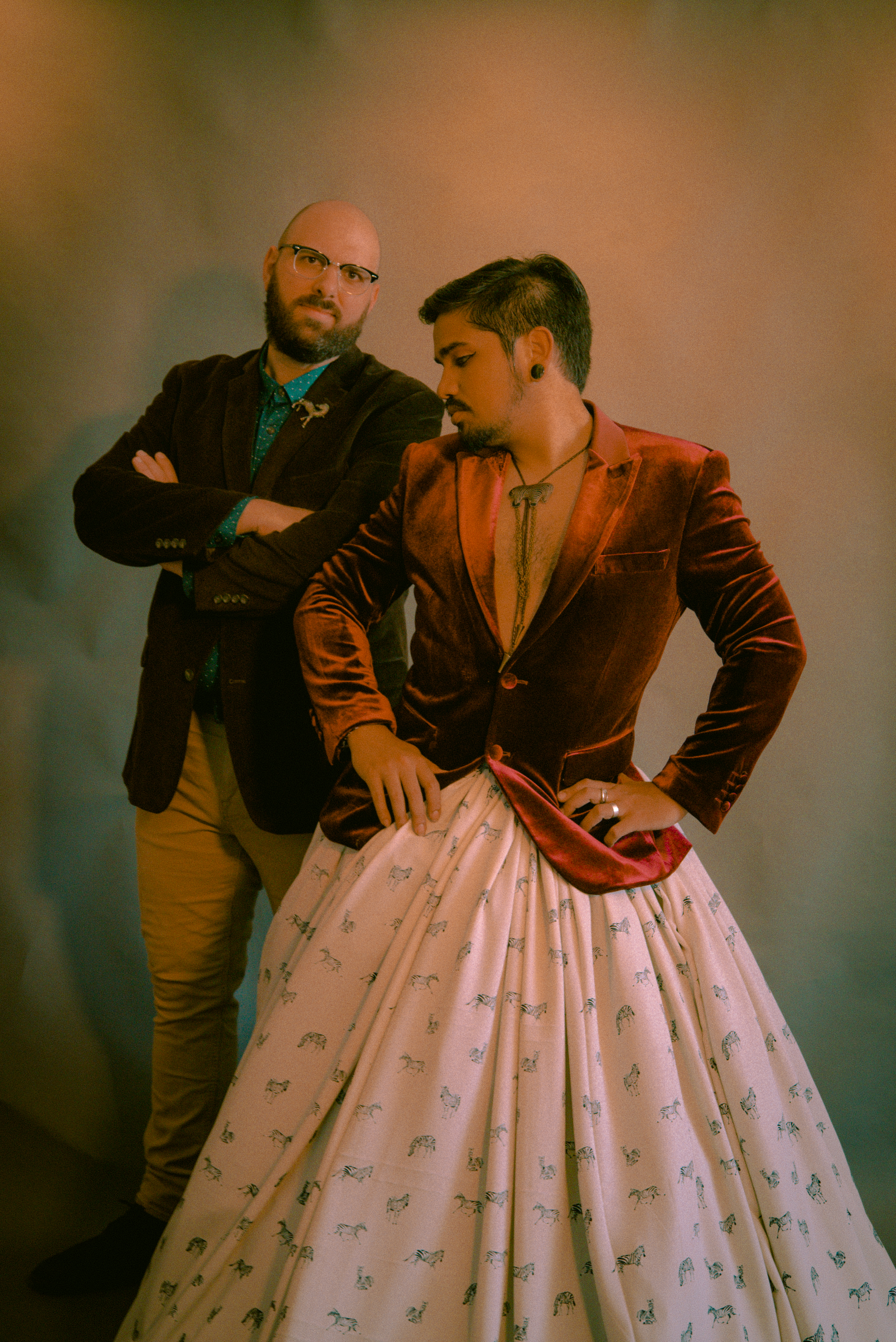 two members of ThebandIvory pose wearing velvet jackets